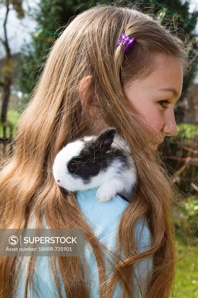 Girl, 10 years old, with a pet rabbit, Bavaria, Germany, Europe