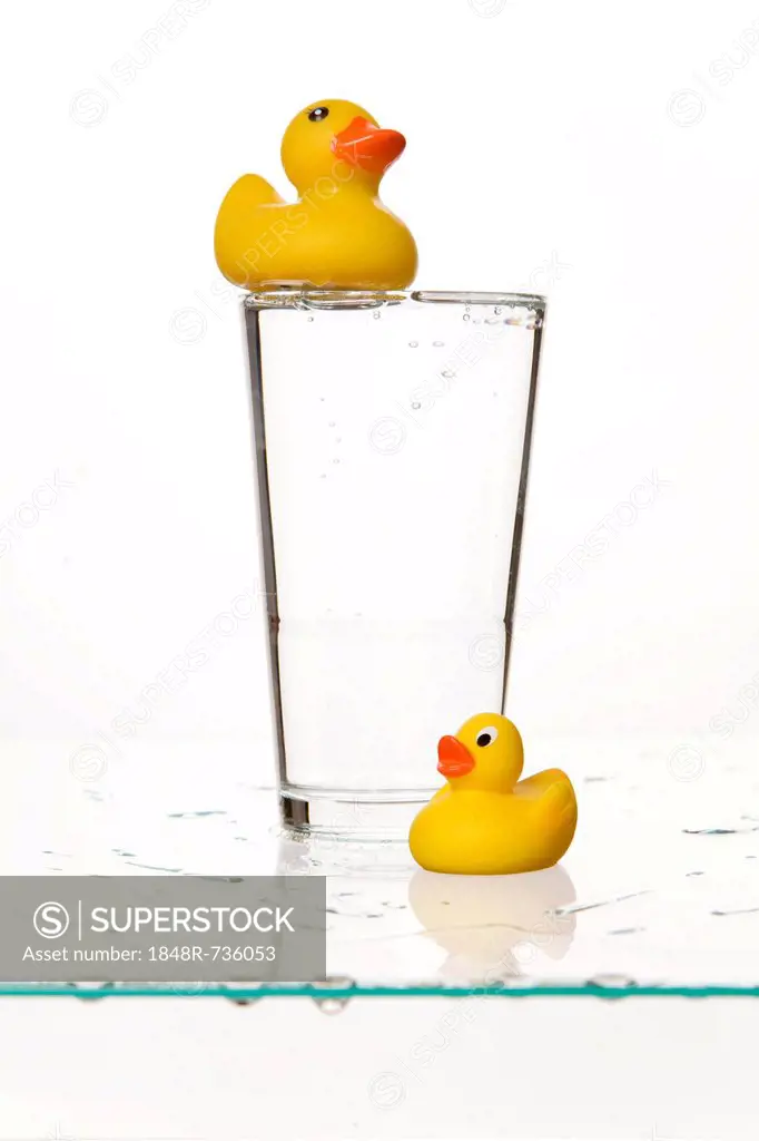 Glass with yellow rubber ducks