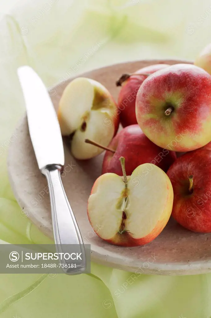 Apples in bowl with knife
