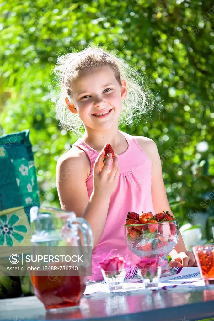 Girl at a garden table