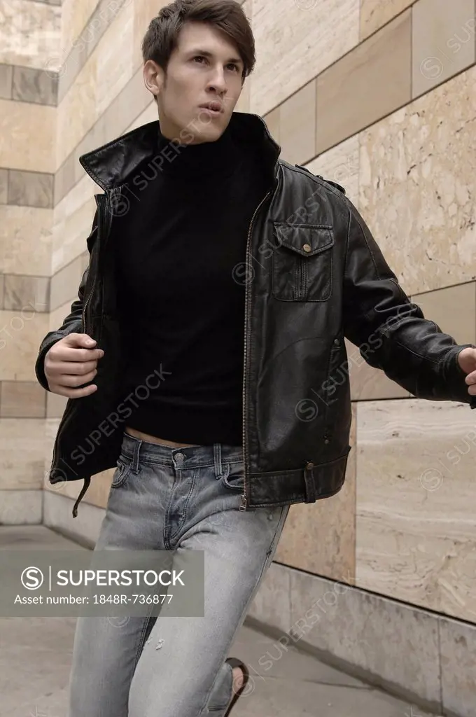 Man wearing a leather jacket, running