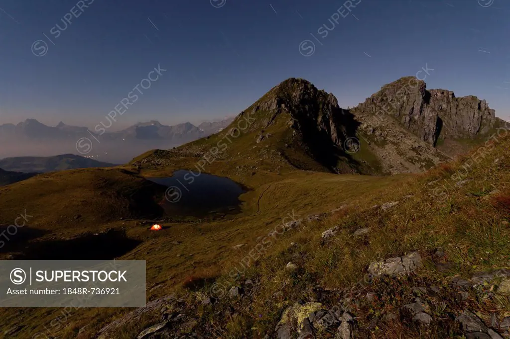 Night shot, Lake Berglimattsee with illuminated tent, Glarus Alps, Canton Glarus, Switzerland, Europe