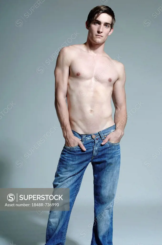 Young man with bare chest and jeans