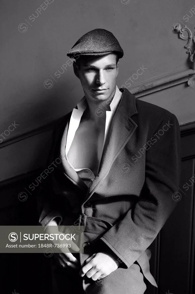 Nostalgic portrait of a man on a staircase in a film-noir style