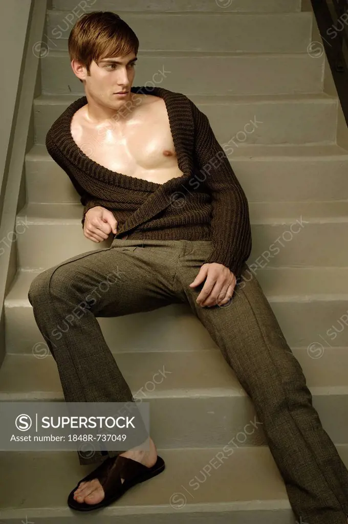 Young man sitting on the stairs