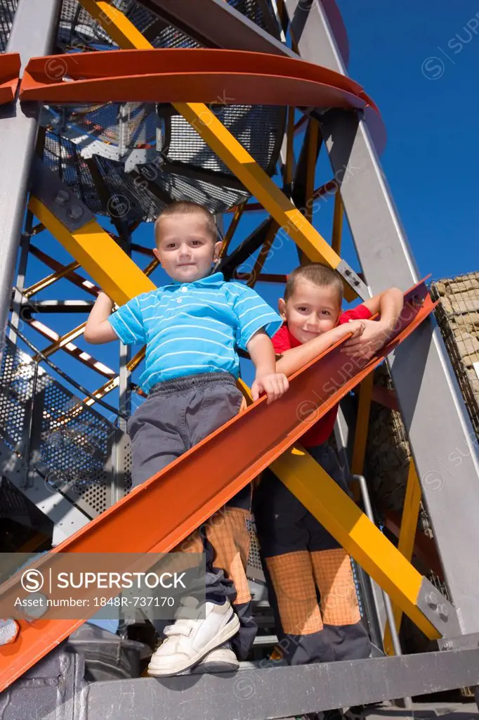 Boys, 6 and 4 years, on a lookout tower
