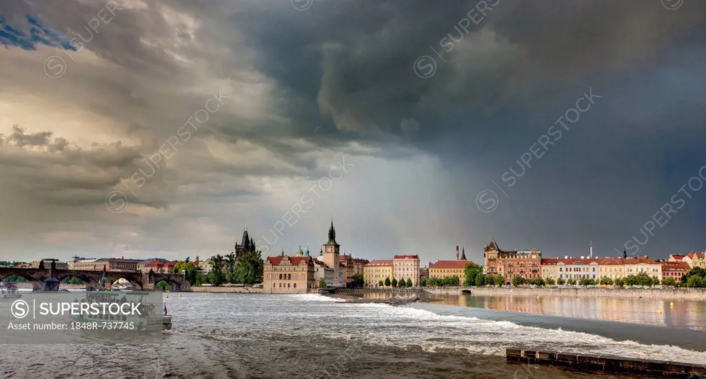 Overlooking the River Vltava in a thunderstorm and rain, Charles Bridge, Smetana Museum, a former waterworks, the Old Town Bridge Tower, Water Tower, ...