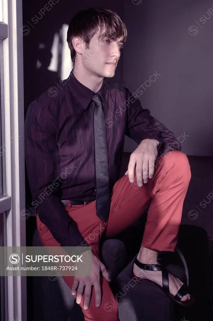 Man sitting at the window, fashion shoot