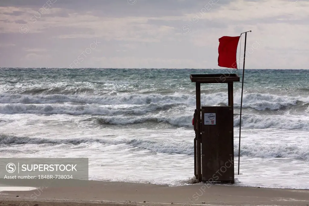 Lifeguard watch tower on the beach of Playa Torá with a red Flag and waves, Peguera, Majorca, Balearic Islands, Spain, Europe