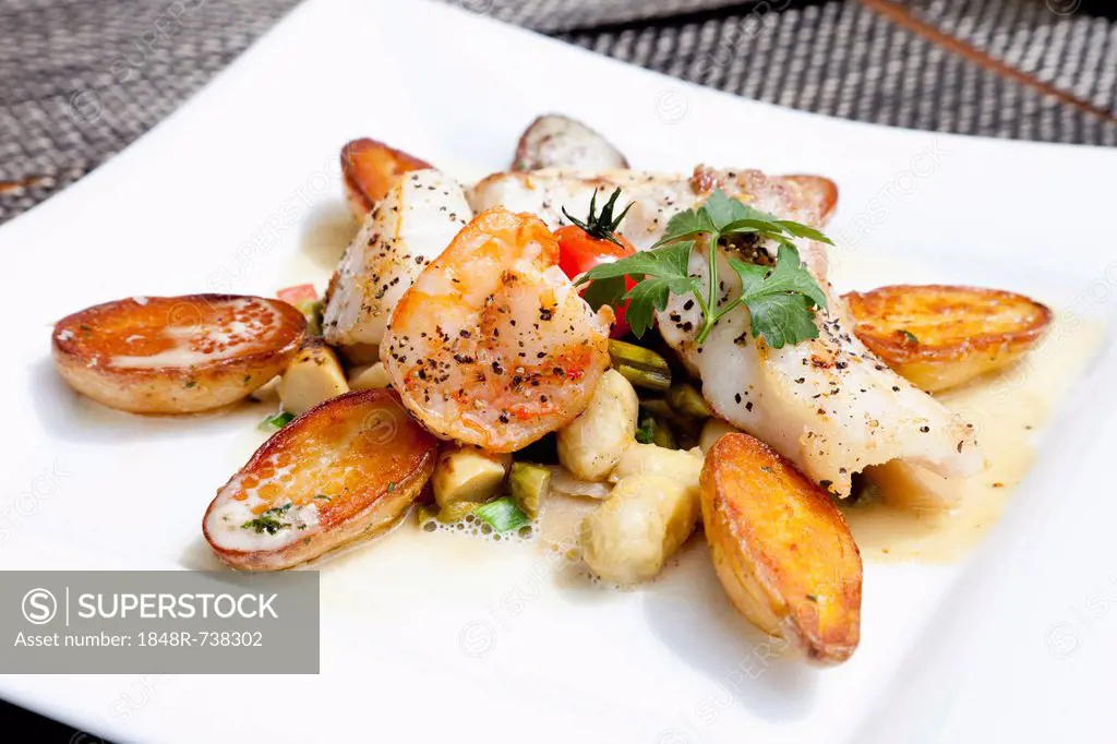 Medley of fish with rosemary potatoes and mixed vegetables