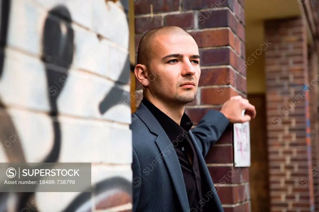 Young man in urban setting, portrait