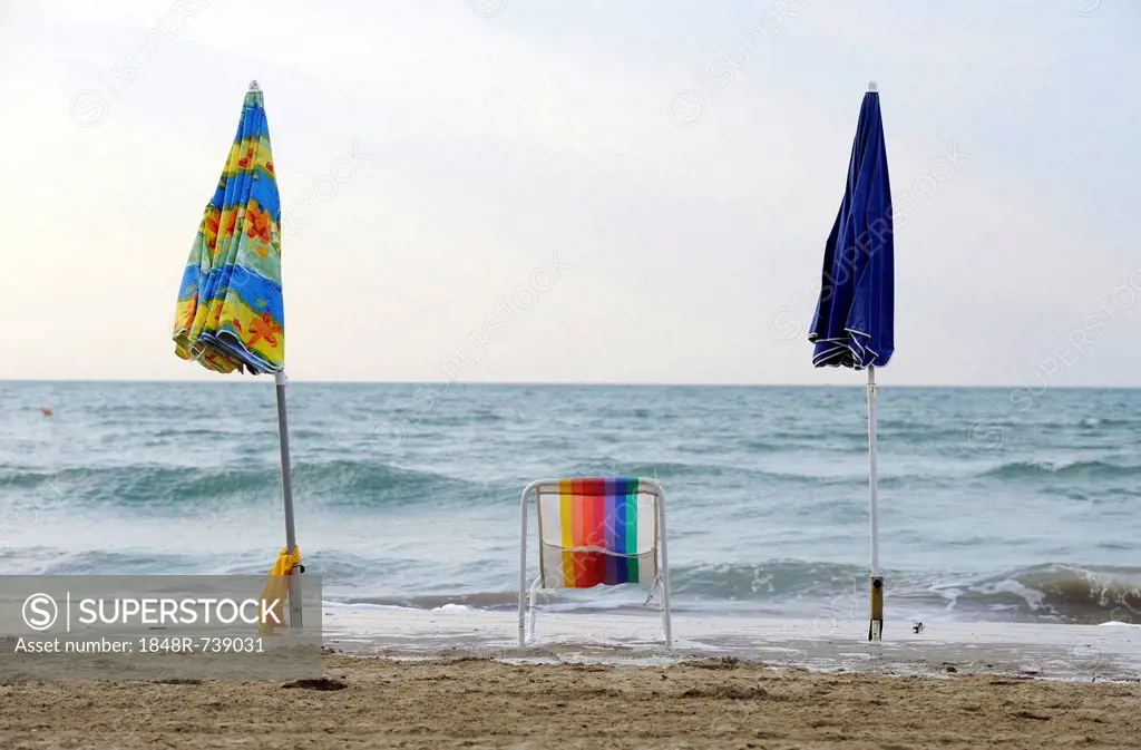 Deck chair with parasols on the beach of the northern Adriatic Sea near Cavallino camping site, Jesolo, Venice, Italy, Europe