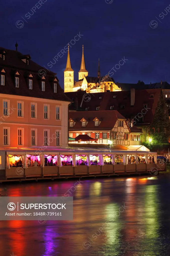 Marquee at Sandkerwa, folk festival, on the bank of the Regnitz river, with St. Michael church, Bamberg, Upper Franconia, Franconia, Bavaria, Germany,...