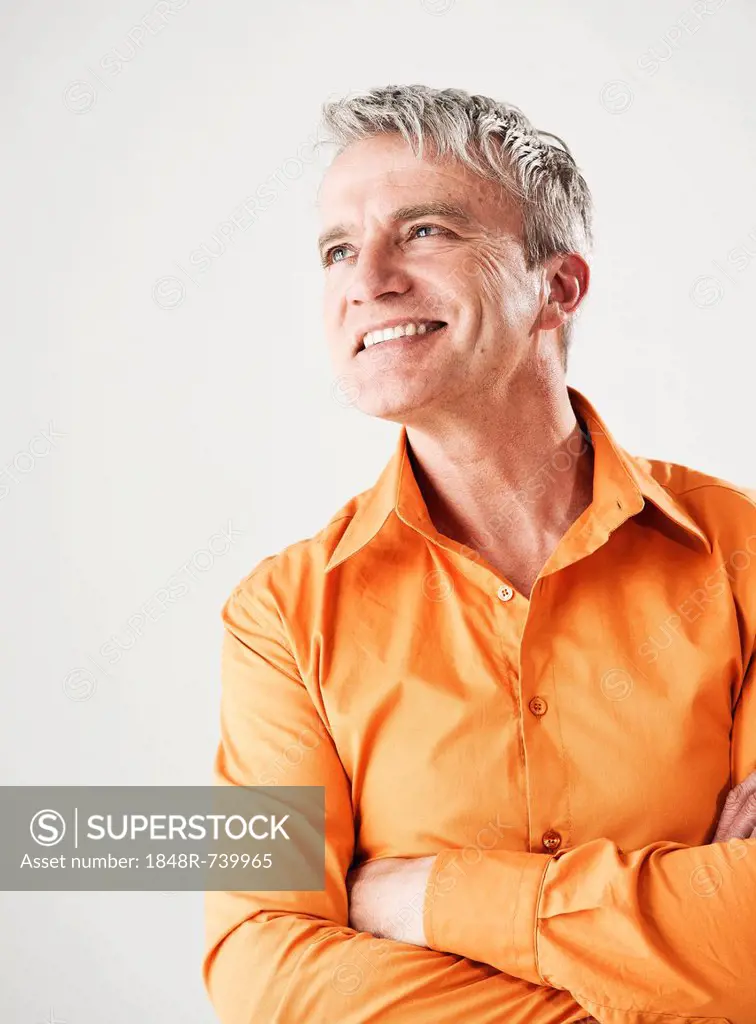 Smiling businessman staring into the distance