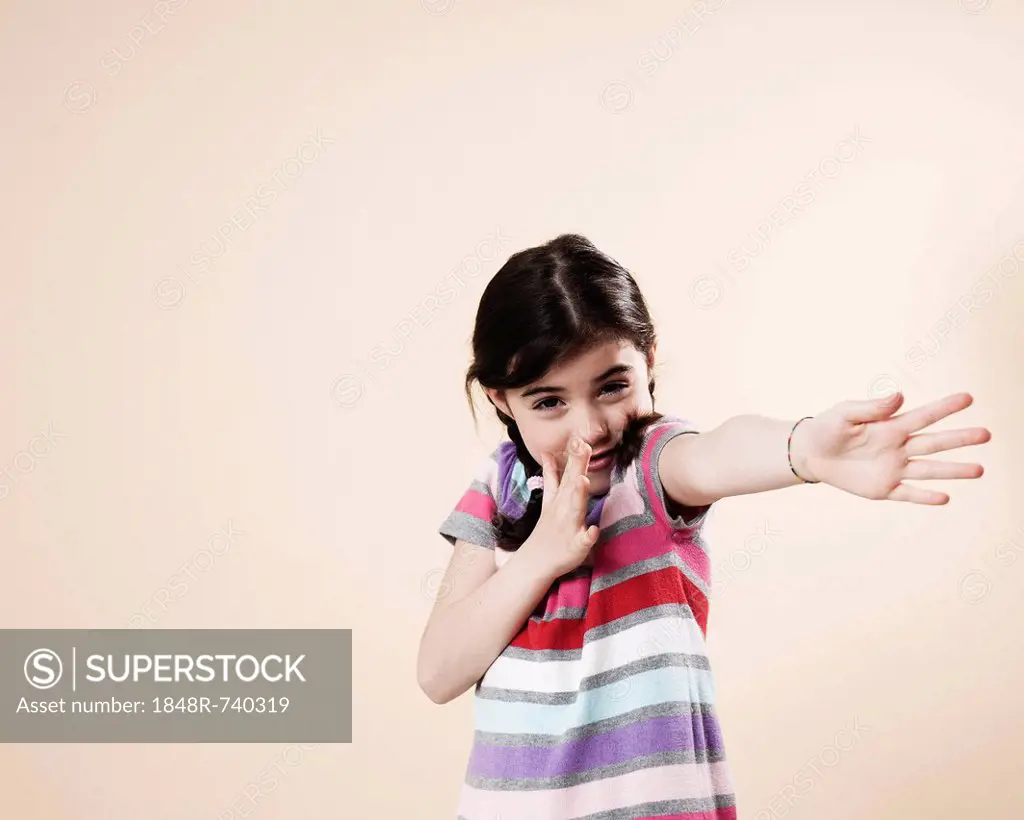 Girl pointing a little to one side