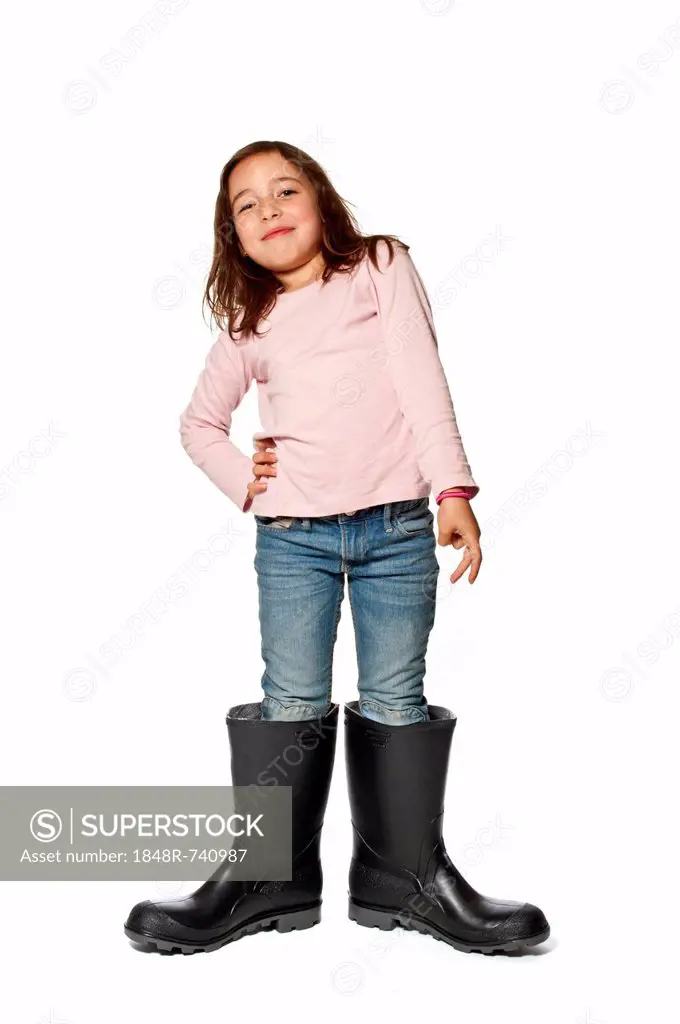 Seven-year-old girl wearing gumboots that are far too big