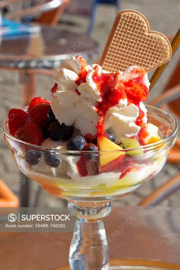 Ice cream with fruit and whipped cream