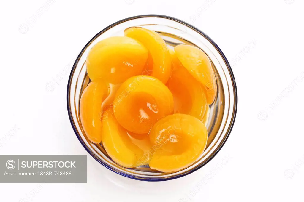 Apricot halves in a glass bowl