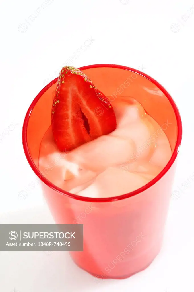 Red cup with yogurt and strawberry