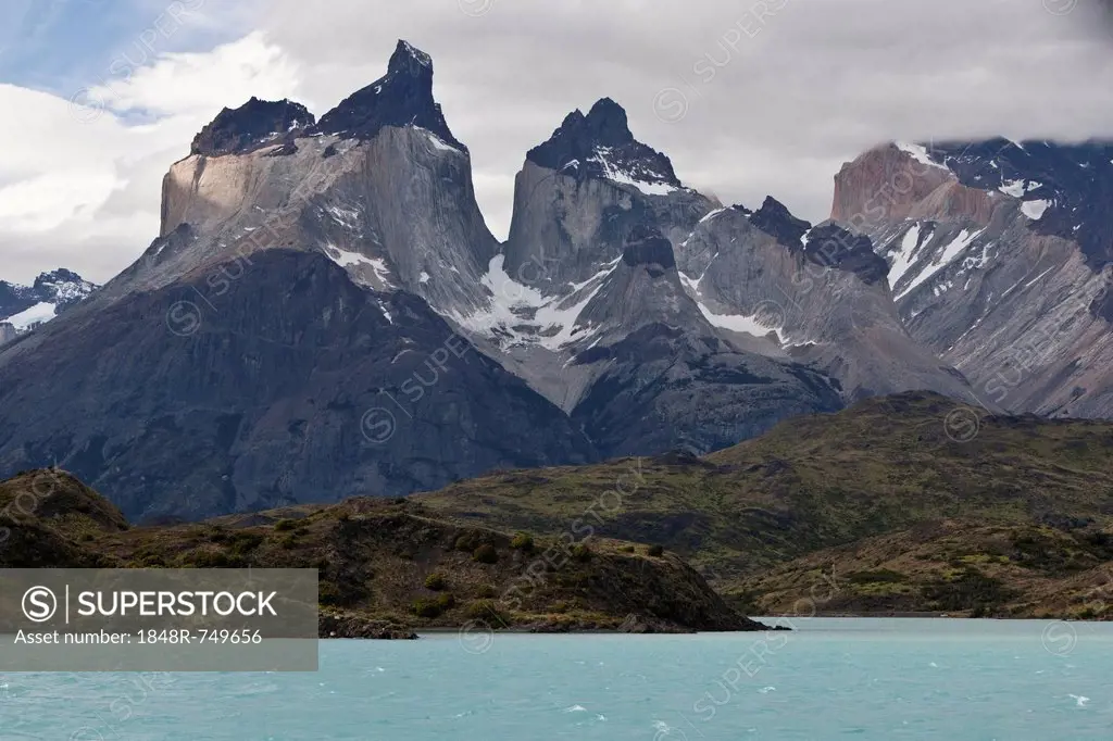 View of the dark peaks of the Cuernos del Paine granite mountains, Torres del Paine National Park, Lake Pehoe, Magallanes Region, Patagonia, Chile, So...