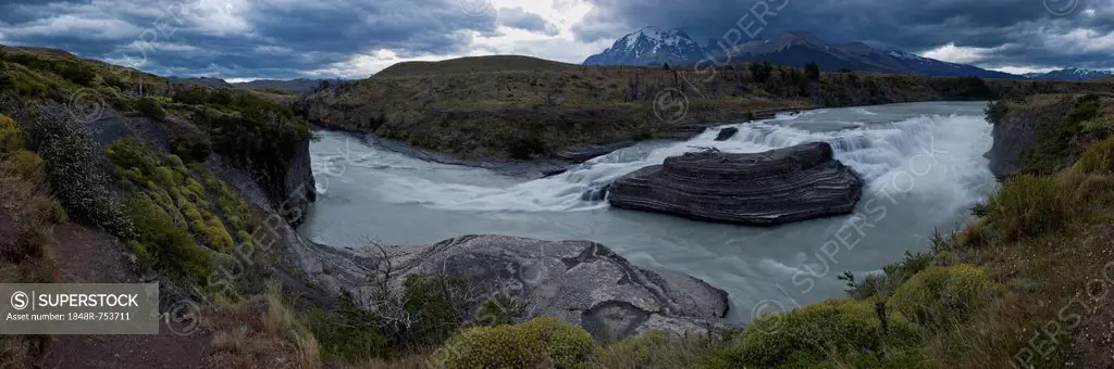 Panoramic view of a waterfall along the glacial river of Rio Paine in Torres del Paine National Park, Lake Pehoe, Magallanes Antartica region, Patagon...