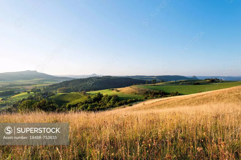 View of the volcanic landscape of the Hegau region with the mountains Hohenstoffeln, Hohenhewen and Hohenkraehen, from left, Baden-Wuerttemberg, Germa...