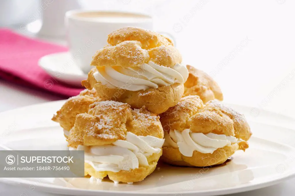 Plate of cream puffs, choux pastry filled with cream