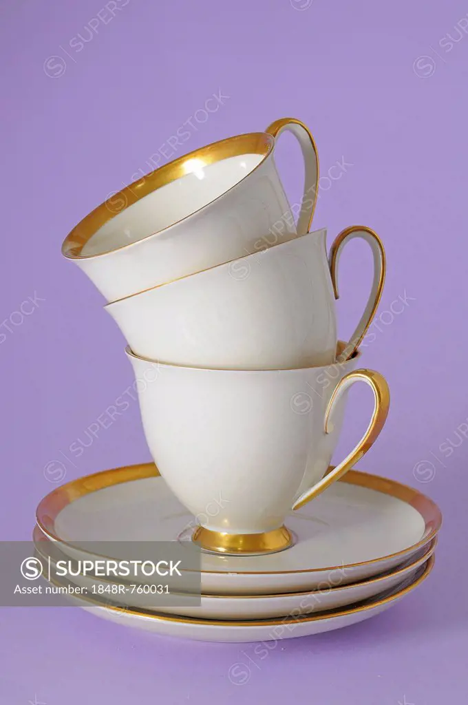 Antique coffee cups with a gold rim