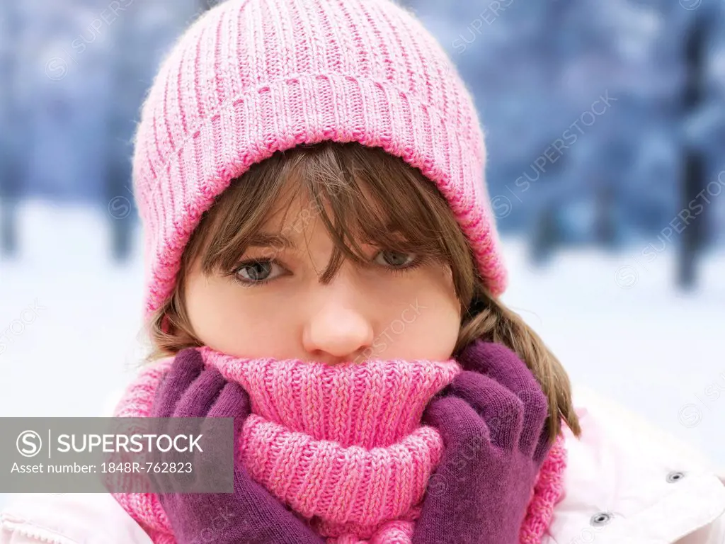 Girl with pink woolly hat, portrait, winter
