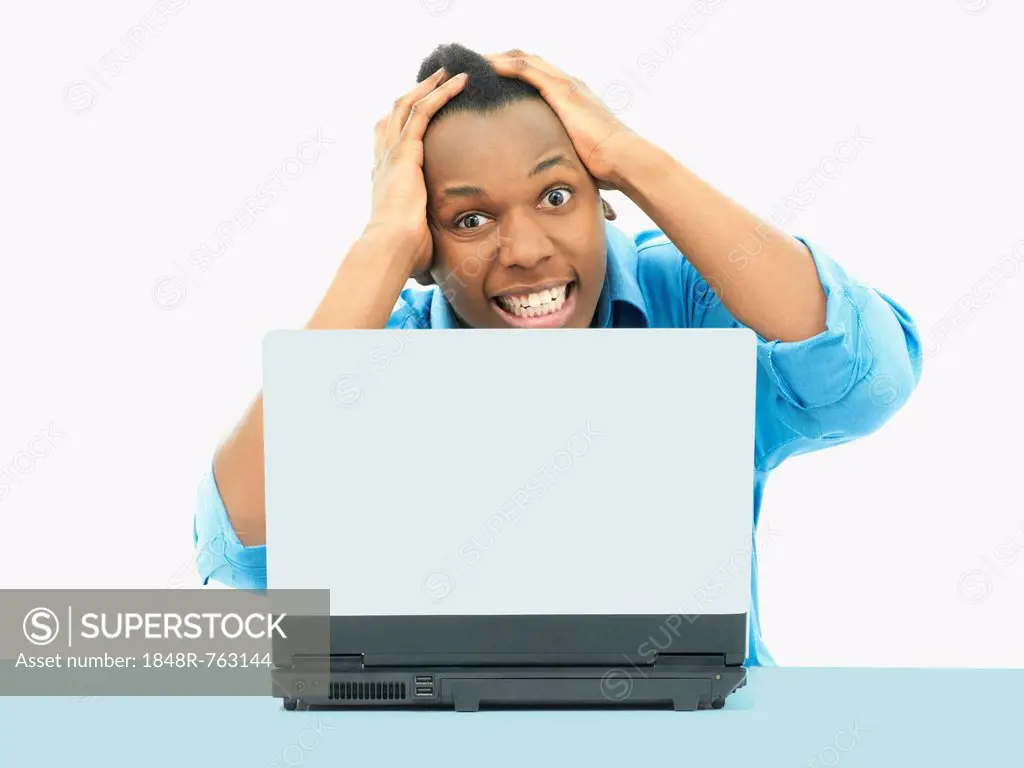 Businessman, using a laptop, looking desperate