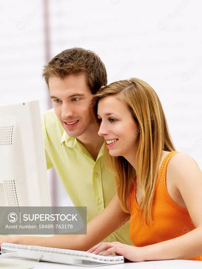 Young couple using a computer