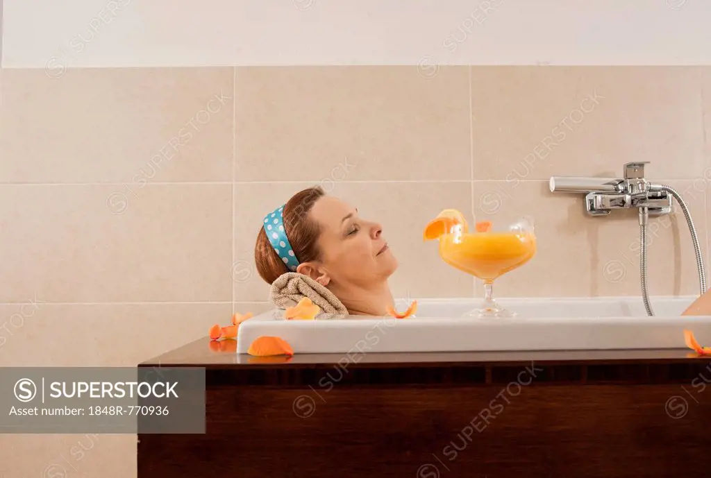 Woman relaxing in a bath