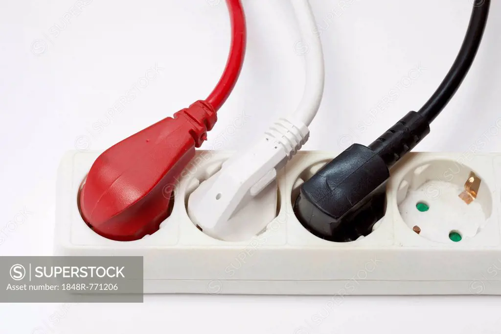 Power strip with three different coloured plugs