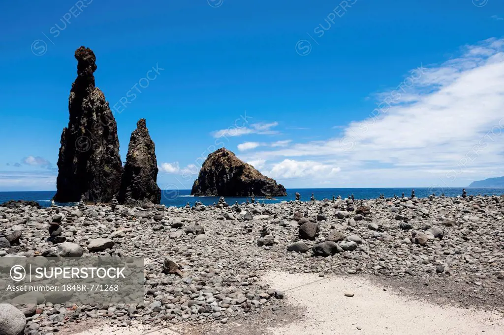 Cairns built as good luck charms at the Ilheus da Rib rock formation, on the cliff coast of Ribeira da Janela, Lanceiros, Ribeira da Janela, Madeira, ...