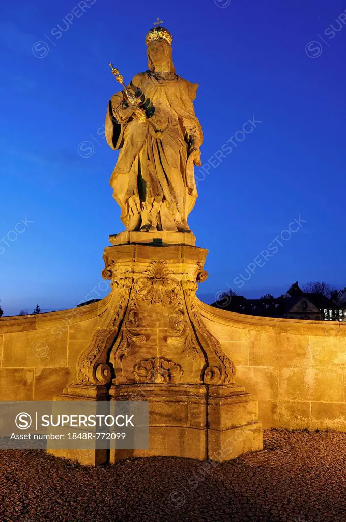 Statue of Empress Cunegonde, 980-1033, on Unteren Bruecke, Lower Bridge, in the evening light against the blue night sky, Untere Brücke, Altstadt, Bam...