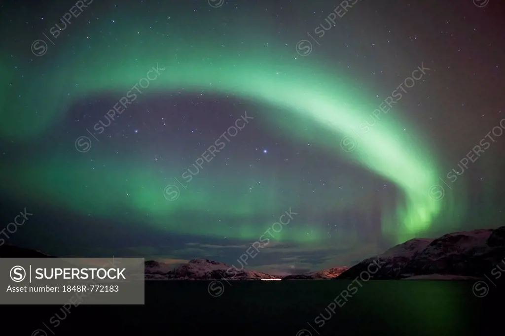 Northern Lights over the Grøtfjord in winter, Kvaloya, Tromso, Norway, Europe