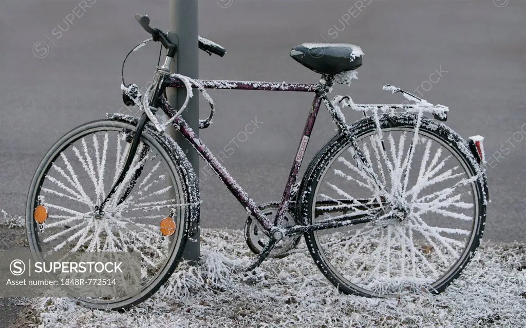 Bicycle covered with hoarfrost, Germany