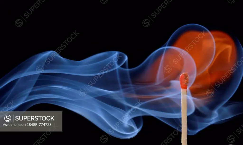 Lit matchstick with a flame and smoke, Germany