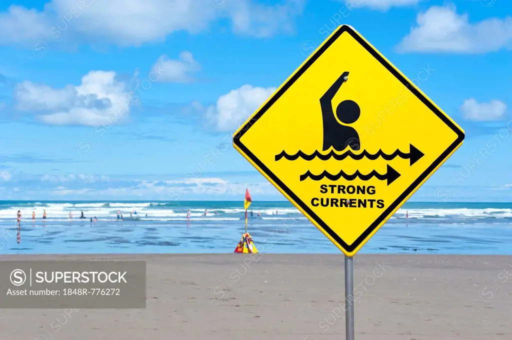 Warning sign strong currents, on a beach, Muriwai Beach, West Coast, Auckland, Auckland Region, New Zealand