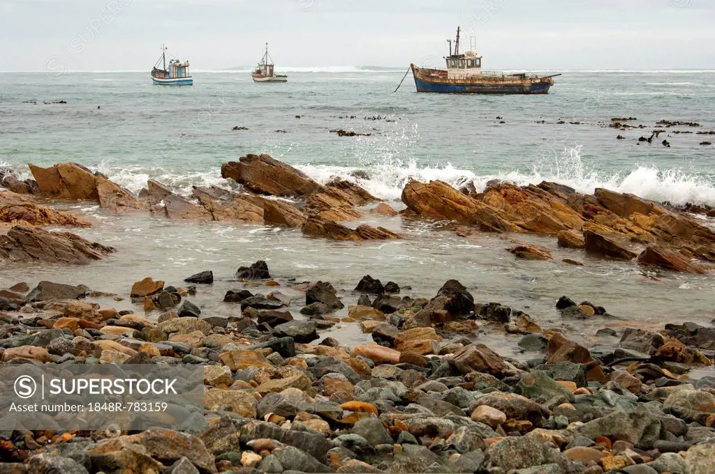 Fishing boats in bad weather at sea off the coast of Port Nolloth, Northern Cape Province, South Africa, Africa