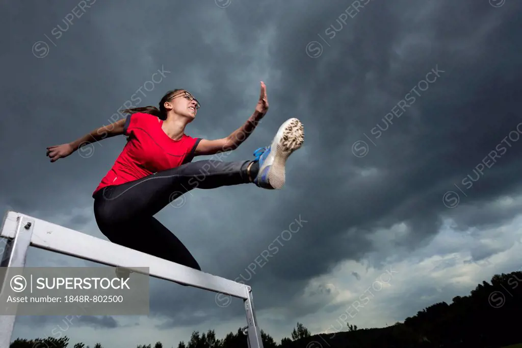 Athlete, 20 years, jumping hurdles, Winterbach, Baden-Württemberg, Germany