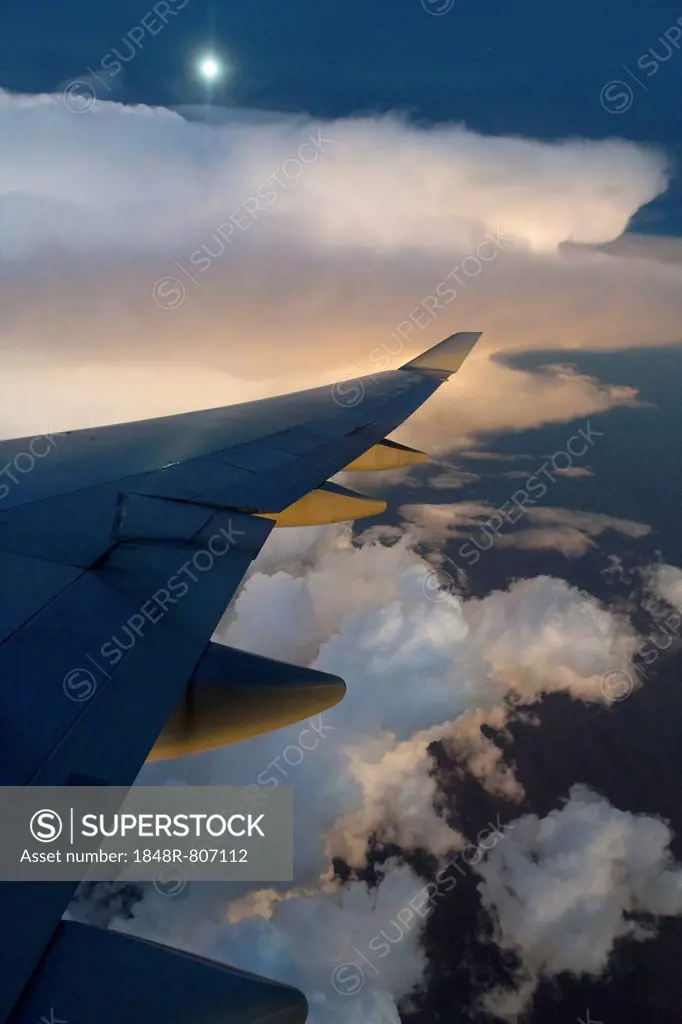 View from a Boeing 747-400 of a storm front at full moon, Australia