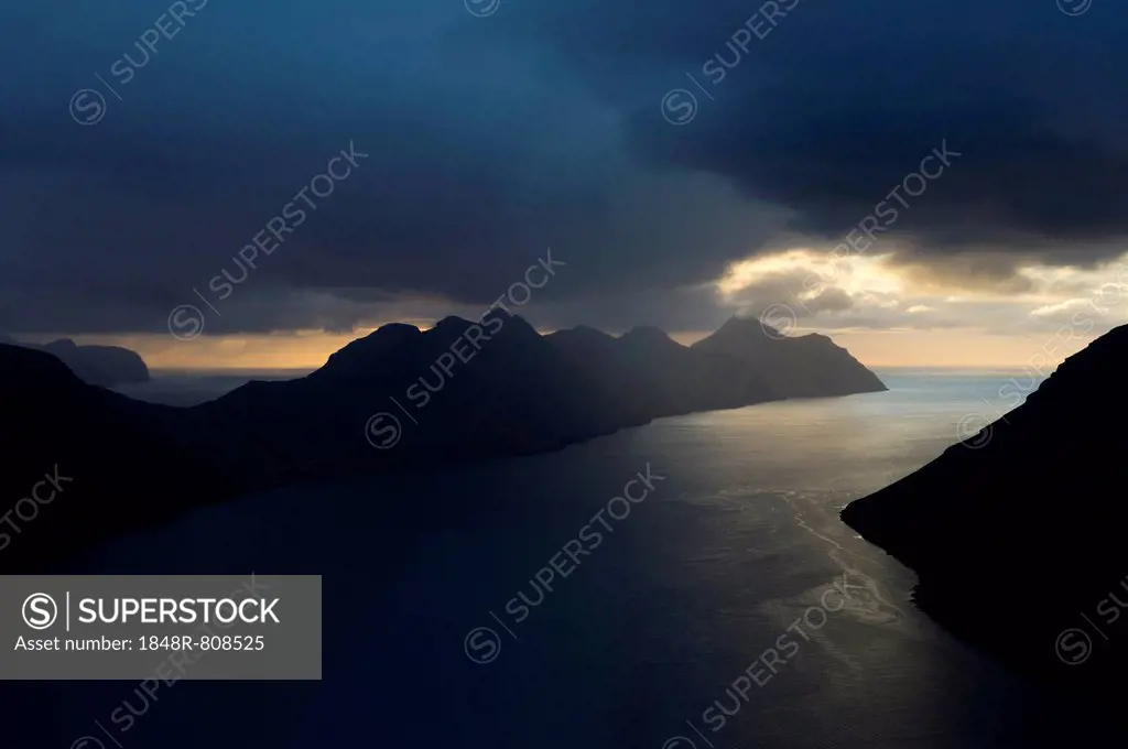 Dramatic mood lighting over the islands of Kalsoy and Kunoy, Kalsoy, Norðoyar, Faroe Islands, Denmark
