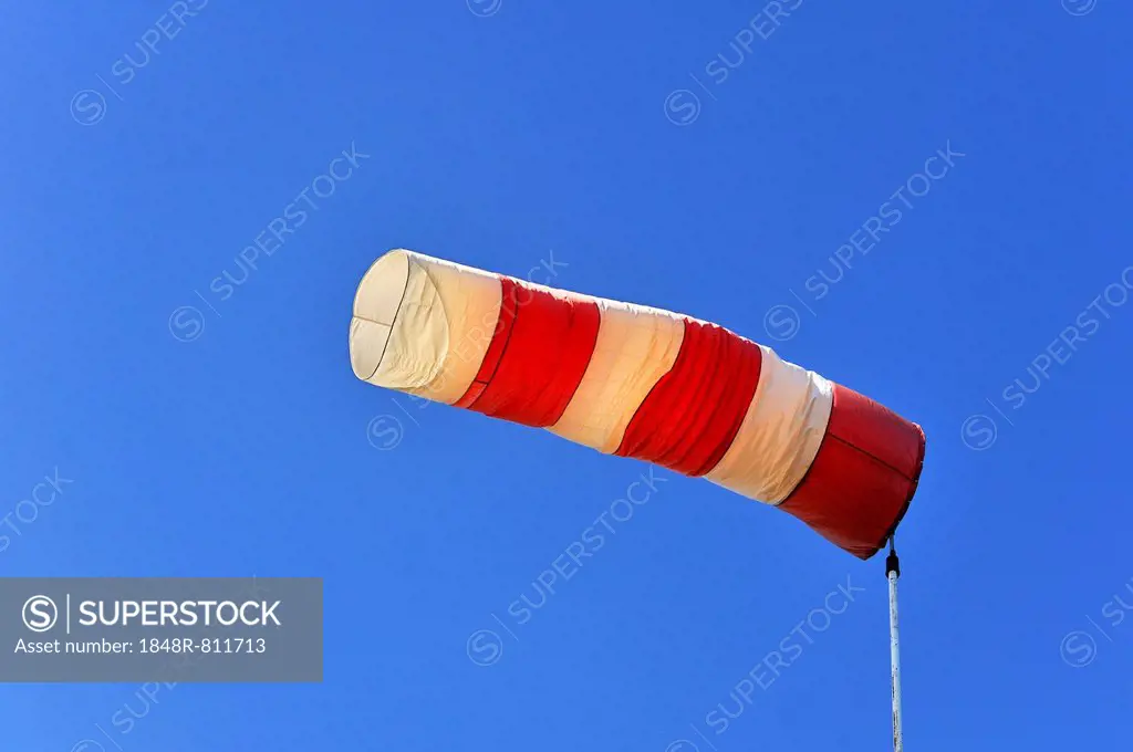 Red and white windsock against a blue sky, Lilling, Middle Franconia, Bavaria, Germany