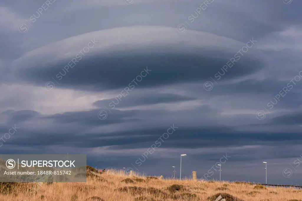 Cloud in the shape of a UFO, lenticular cloud, somber lighting, Brocken, Wernigerode, Saxony-Anhalt, Germany
