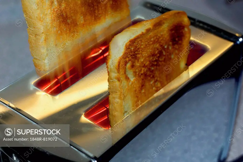 Toast slices flying out of the toaster