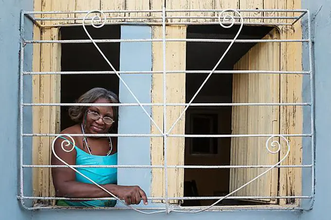 Woman at window, Santiago de Cuba, Cuba, Central America