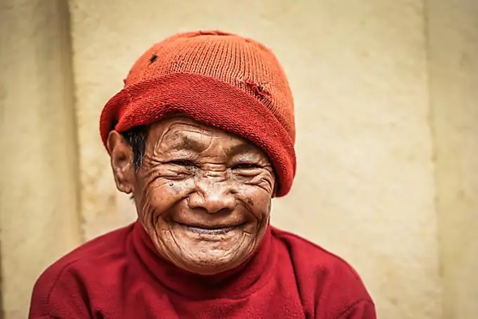 Laughing woman with cap, Bandipur, Kathmandu Valley, Nepal, Asia