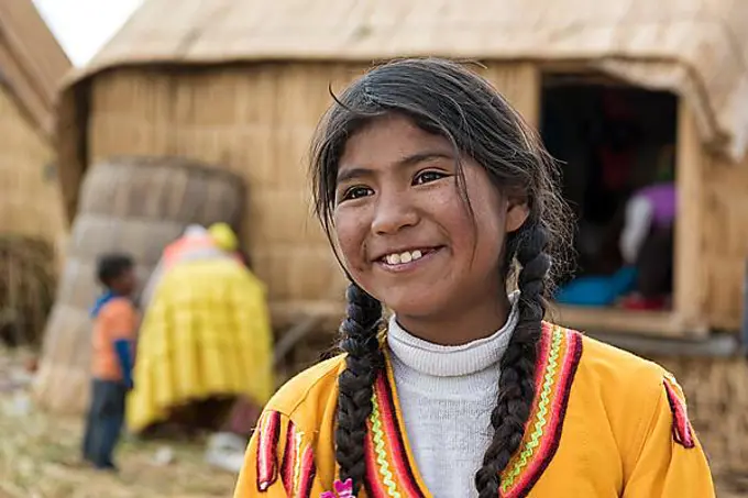 Local girl laughs, portrait, tribe of the Urus, Lake Titicaca, Puno region, Peru, South America