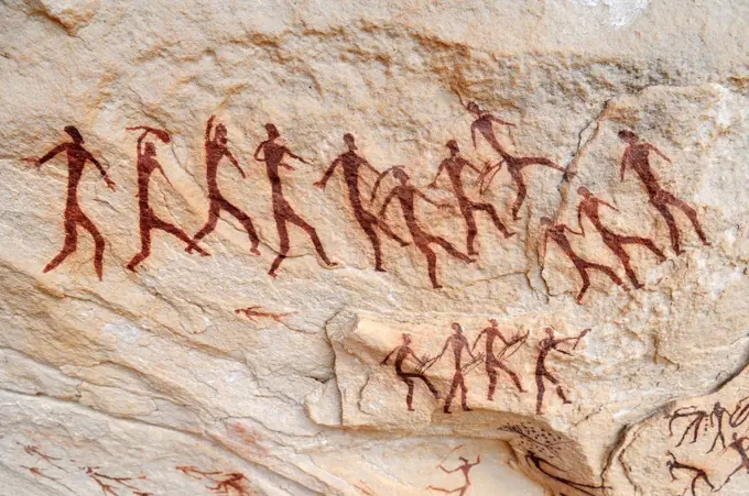 Group of painted warriors or hunters, neolithic rock art at Arakokem, Adrar Tekemberet, Immidir, Algeria, Sahara, North Africa